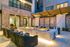 outdoor fireplace with cushioned outdoor seating
