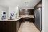 kitchen with dark brown cabinets, granite counters, and stainless steel appliances