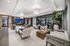 lounge with lounge seating and tables and tv