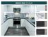 kitchen photos with dark wood flooring, white wood cabinets, black granite countertops, and marble title backsplash