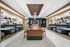 coworking lounge with communal table and 4 booth seating areas
