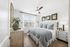 bedroom with ceiling fan, dresser, king size bed and large nightstands