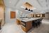 entertaining lounge with counter height seating and fridge, oven, stove, microwave and ice maker