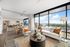 apartment with open-concept living and kitchen area and floor to ceiling windows