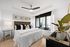 bedroom with large windows, ceiling fan and light fixture, with king-size bed, nightstands and a dresser