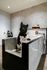 dog wash station with black and white medium sized dog in the tub