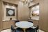 meeting room with round table and 4 chairs with TV on one wall
