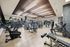 fitness center with decorative wood ceiling and lights, and weight, cardio, and strength machines