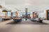 Co-working space with sofa sitting conferernce tables and banquette sitting area