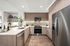 Kitchen with an oven, microwave and a refrigerator