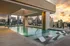 Resort style pool on the terrace with pool chairs overlooking the Dilworth skyline