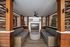 covered cabana with open wood-slate dividers, two couches, TV, and ceiling fan