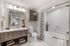 Elegant and modern bathroom with stylish vanity, chic decor, and luxurious marble finishes.