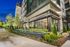 Elegant exterior of Hanover Edgewood showcasing modern design and lush landscaping in an urban setting.