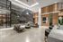 Luxurious lobby with modern marble accents, cozy seating area, stylish decor, and warm ambient lighting.