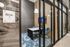 Elegant meeting room with modern decor, featuring plush seating, a contemporary table, and vibrant artwork. Ideal for creative discussions and professional gatherings.