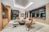 Luxurious and modern living room featuring a cozy L-shaped sofa, elegant lighting, and stylish decor.