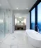 Luxurious modern bathroom with marble flooring, a sleek freestanding bathtub, and a glass-enclosed shower offering stunning city views.