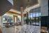 Elegant lobby with modern art and stylish lighting in a luxurious apartment building.