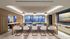 Luxurious open-concept living space with sleek kitchen island, modern pendant lights, and elegant dining area overlooking a scenic urban view.