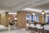 Elegant apartment interior showcasing a modern open-concept lounge and dining area with stylish lighting and chic decor.