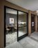 Chic office space featuring a modern round table, stylish chairs, and elegant artwork, perfect for professional meetings.