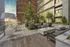 Luxurious outdoor terrace featuring elegant seating with fire pits, modern decor, and lush greenery, ideal for relaxation and entertainment.