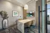 Elegant dining area with a sleek marble table, modern chairs, and a scenic wall painting, perfect for intimate gatherings.
