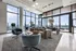 Spacious luxury apartment living room with elegant furnishings, floor-to-ceiling windows, and breathtaking city views.