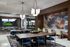 Luxurious dining area with modern chandeliers, stylish wooden tables, and elegant blue chairs, complemented by a vibrant abstract mural.