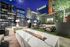 Luxurious rooftop lounge with modern fire pit, stylish seating, and breathtaking city skyline views.