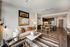 Contemporary open-plan living area featuring stylish decor, a cozy seating arrangement, and a modern kitchen with elegant dining space.