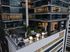 Modern high-rise with luxurious rooftop terrace, featuring stylish outdoor seating and ambient lighting at Hanover Republic Square.