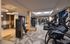 Modern fitness center featuring state-of-the-art exercise equipment, elegant lighting, and spacious design.