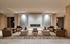 Luxurious lounge area with elegant seating, stylish marble fireplace, and ambient lighting creating a cozy atmosphere.
