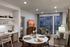 Chic and modern living room with open dining area, cozy seating, stylish decor, and large windows for natural light.