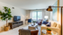 The pleasant living room creates a warm and comfortable atmosphere perfect for daily relaxation. | International Village Lombard | Apartments in Lombard