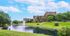 Landscaping, Towers, and Pond at The Views of Naperville apartments
