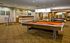 Unleash your competitive spirit in our lively game room featuring classic favorites from <insert game room amenity> to <insert game room amenity>. | International Village Lombard | Apartments in Lombard