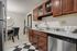 Prepare meals and entertain guests in our community kitchen featuring appliances, prep space, and dining areas. Cooking made convenient. | International Village Lombard | International Village Lombard Apartments