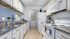 Kitchen with white cabinets and white appliances