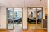Bright and inviting dual group study rooms with large windows and comfortable seating.
