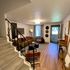 Inviting living room with modern decor, warm lighting, and comfortable seating arrangements.
