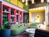 Bright and stylish lounge area with colorful decor and motivational theme.