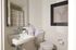 Stylish bathroom featuring modern fixtures, a sleek sink, and tasteful decor.