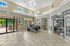 Light-filled, tile-floored receptions area at  Edge at Lafayette | Student Housing Lafayette, LA