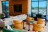 Modern and inviting apartment lounge featuring plush seating, colorful accent pillows, and large windows with scenic views.