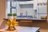 Chic kitchen nook showcasing modern cabinetry, sleek counters, and vibrant decor; perfect for stylish urban living.