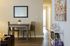 Inviting apartment interior with a modern dining area, sleek decor, and warm lighting, perfect for cozy living.