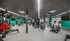 Modern fitness center with state-of-the-art gym equipment and vibrant decor, designed for optimal workout experiences.